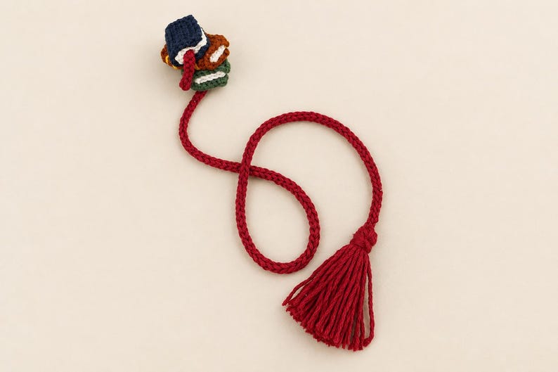 Close view of hand-knitted book stack bookmark